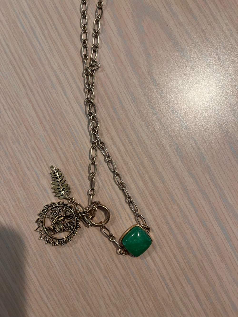 Gold Chain Necklace with Green Stone Pendant and Charm Accents